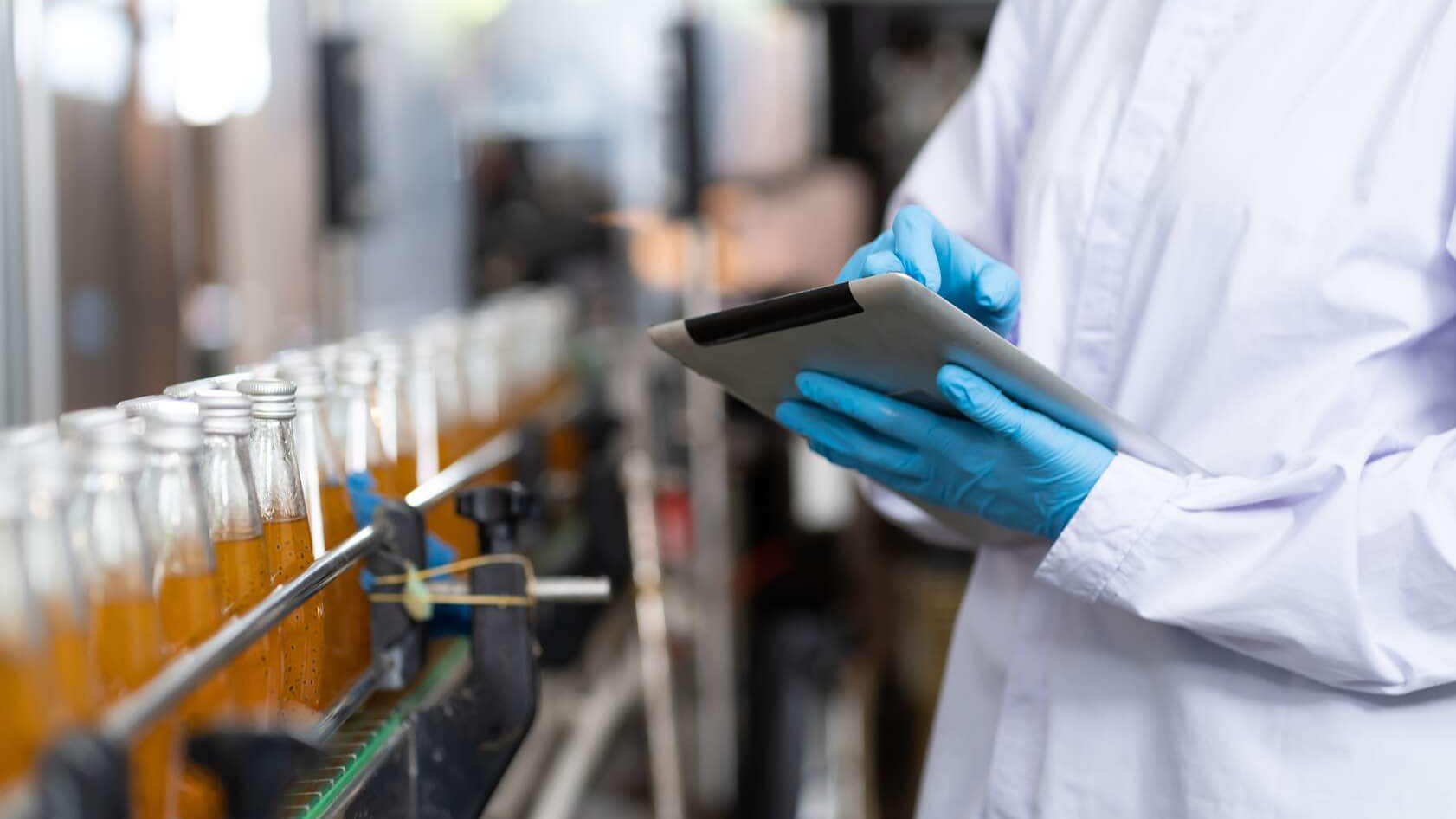 Manufacturer checking product bottles