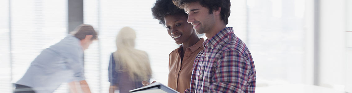 Happy people looking at tablet