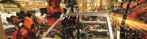 Robots welding car